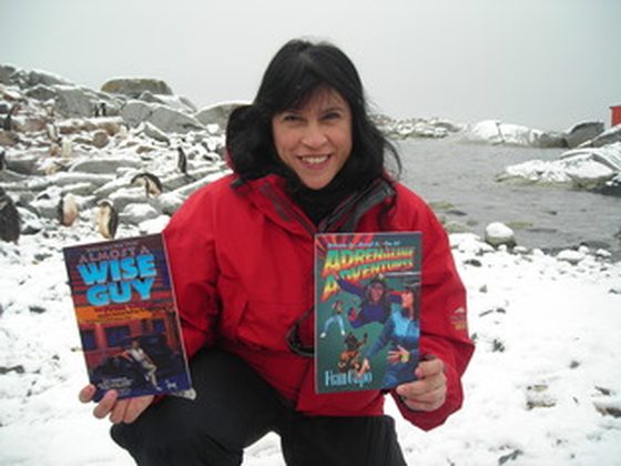 Fran book signing in Antarctica with penguins